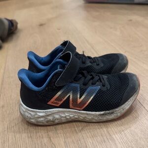 Nike Kids Black Sneakers with Blue Lining and Rainbow Gradient Logo